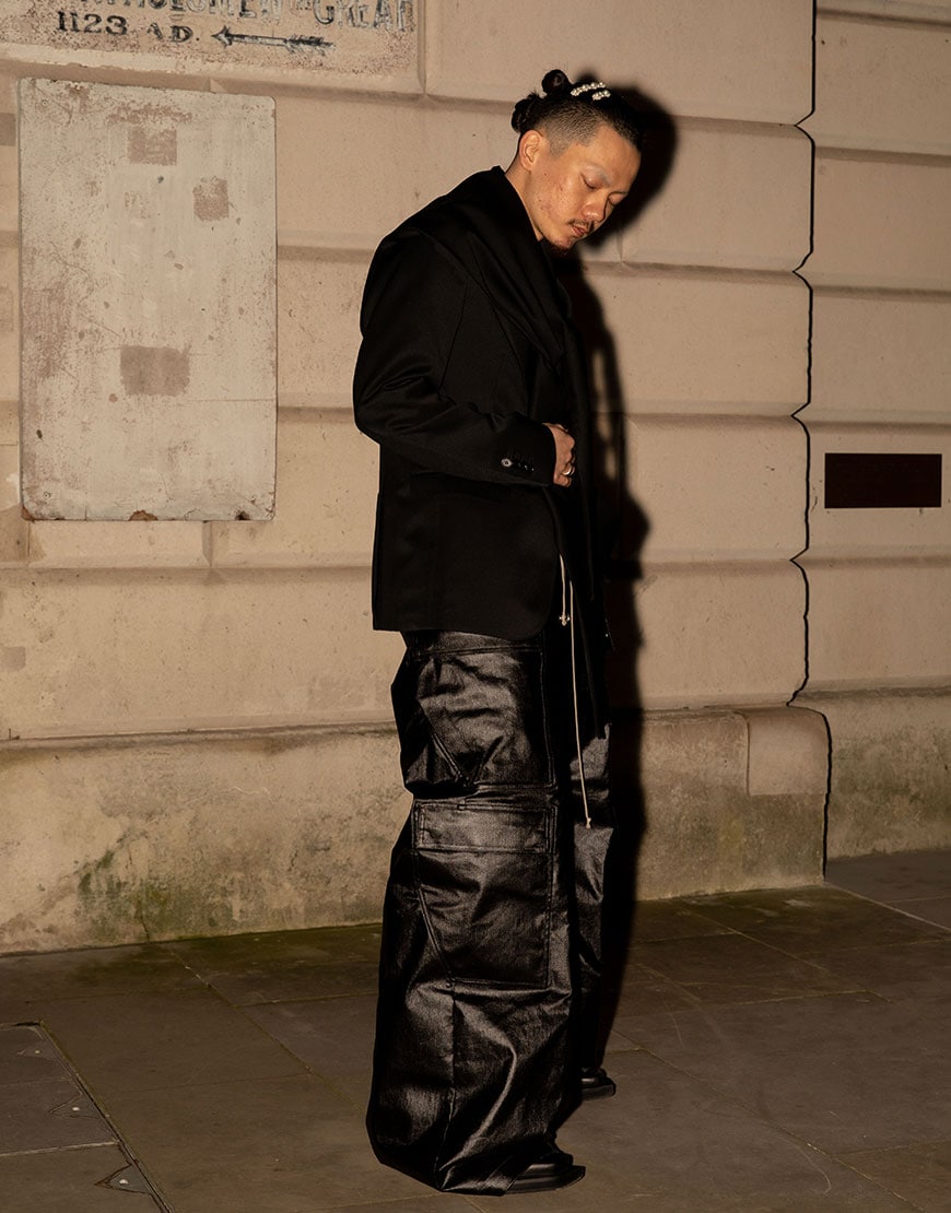 A man wearing black parachute pants | ASOS Style Feed