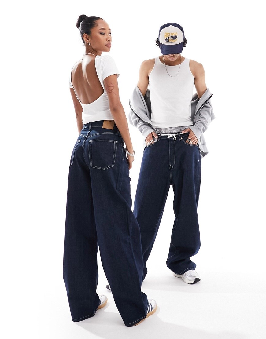 Models wearing dark blue oversized jeans