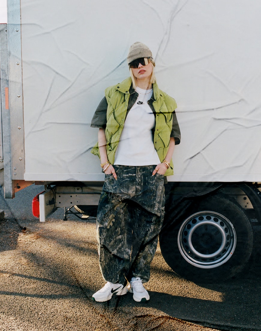 (Slide 16) Lola wears the Nike V2K Run unisex trainers in white and fir green | ASOS Style Feed