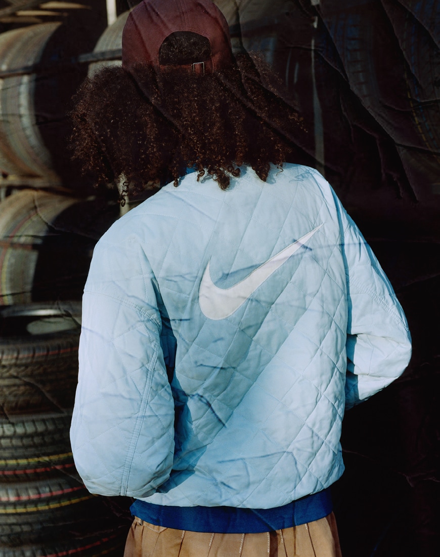 Lola wears the Nike V2K Run unisex trainers in white and fir green |ASOS Style Feed