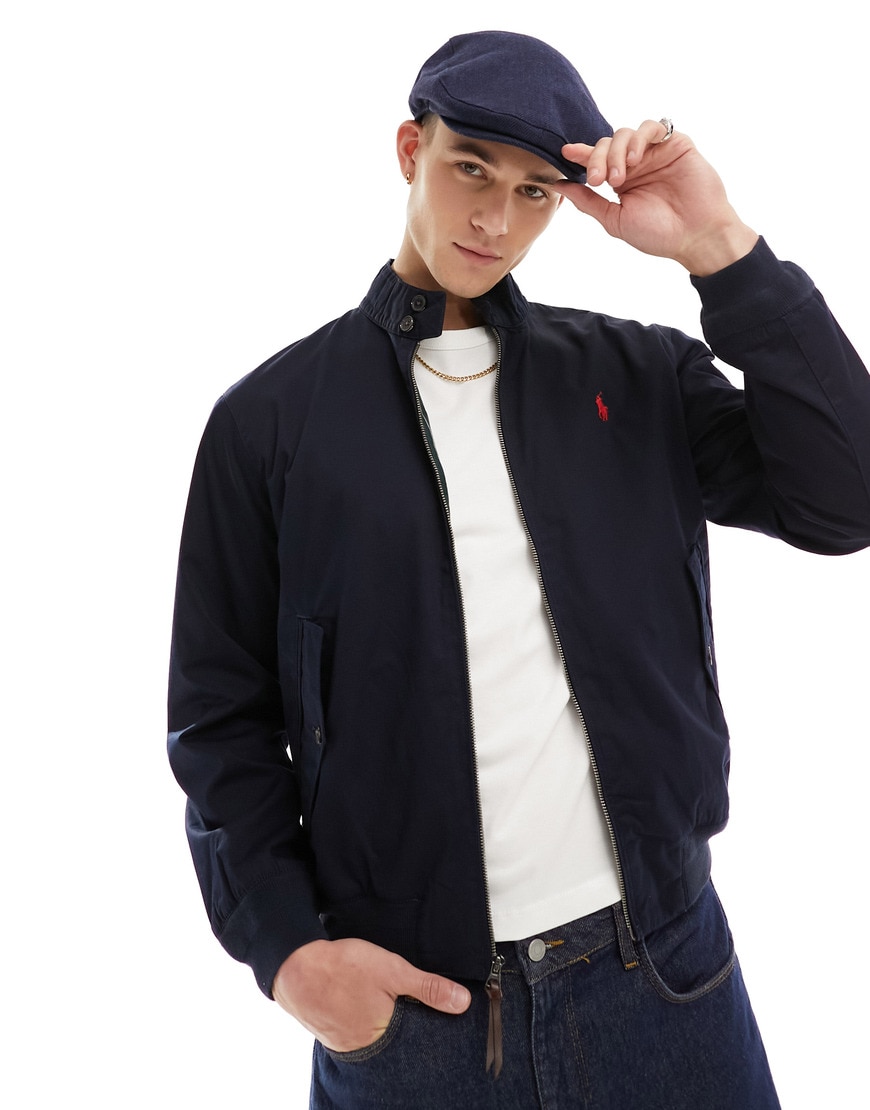 Model wearing a flat cap and harrington jacket