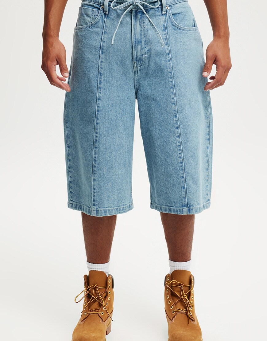 A model wearing blue jorts