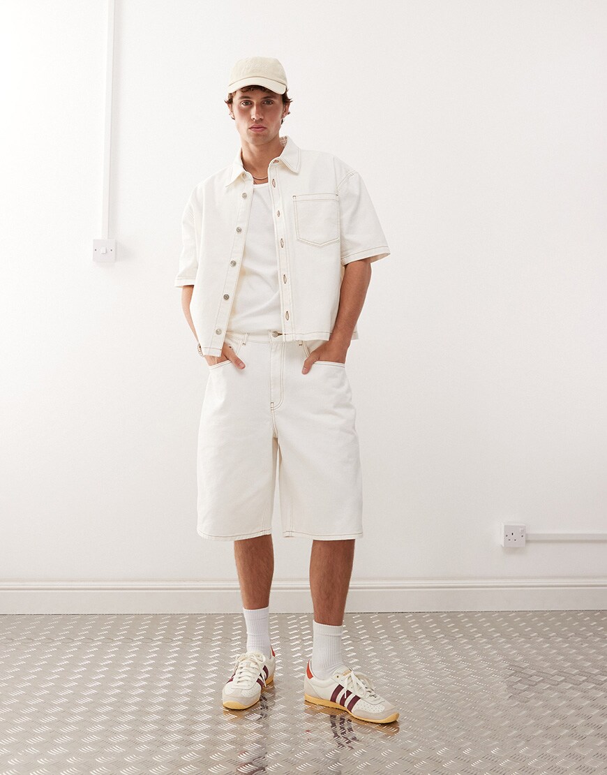 A model wearing ecru jorts