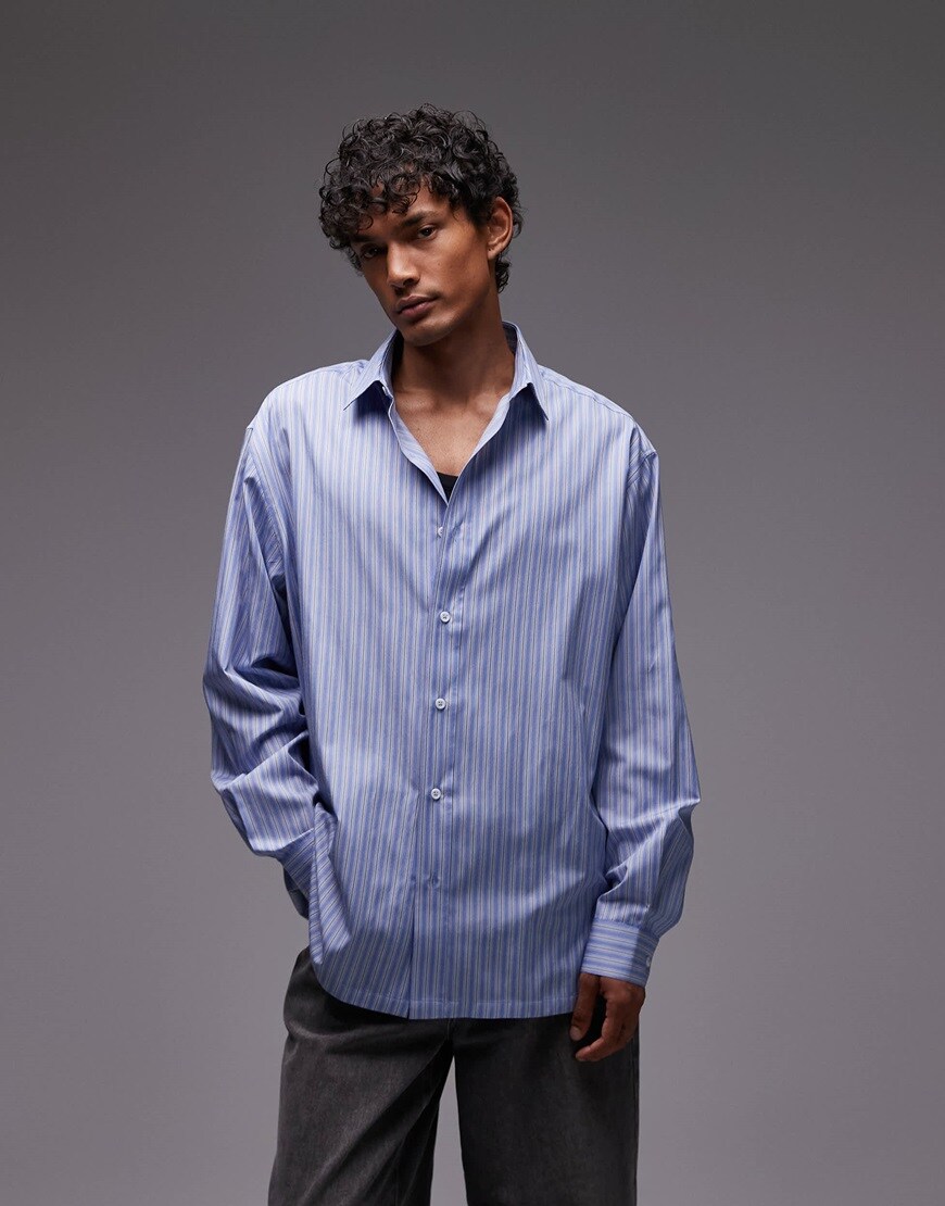 A model wearing a striped blue shirt