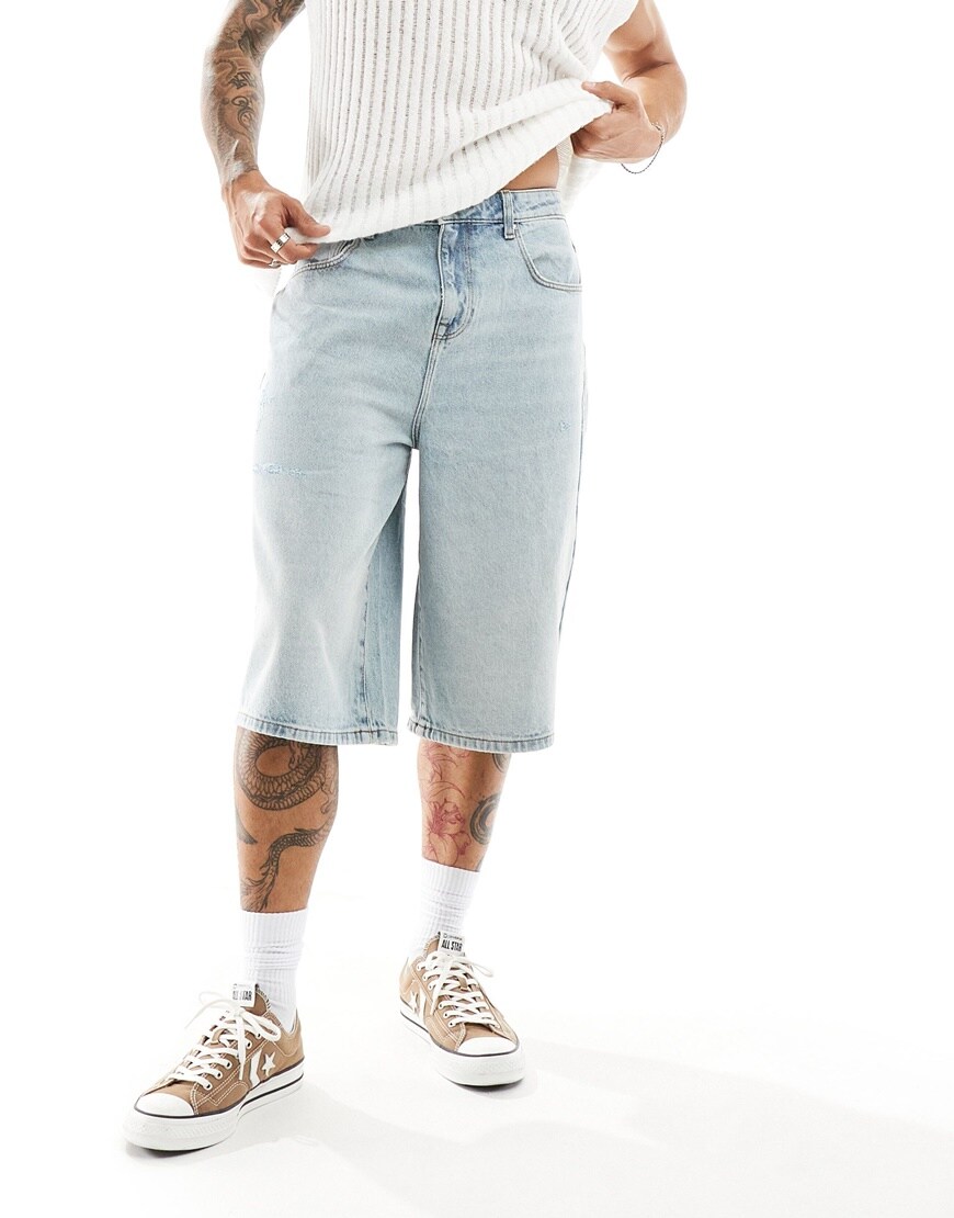 ASOS DESIGN super long length denim jorts with abrasions in light wash blue