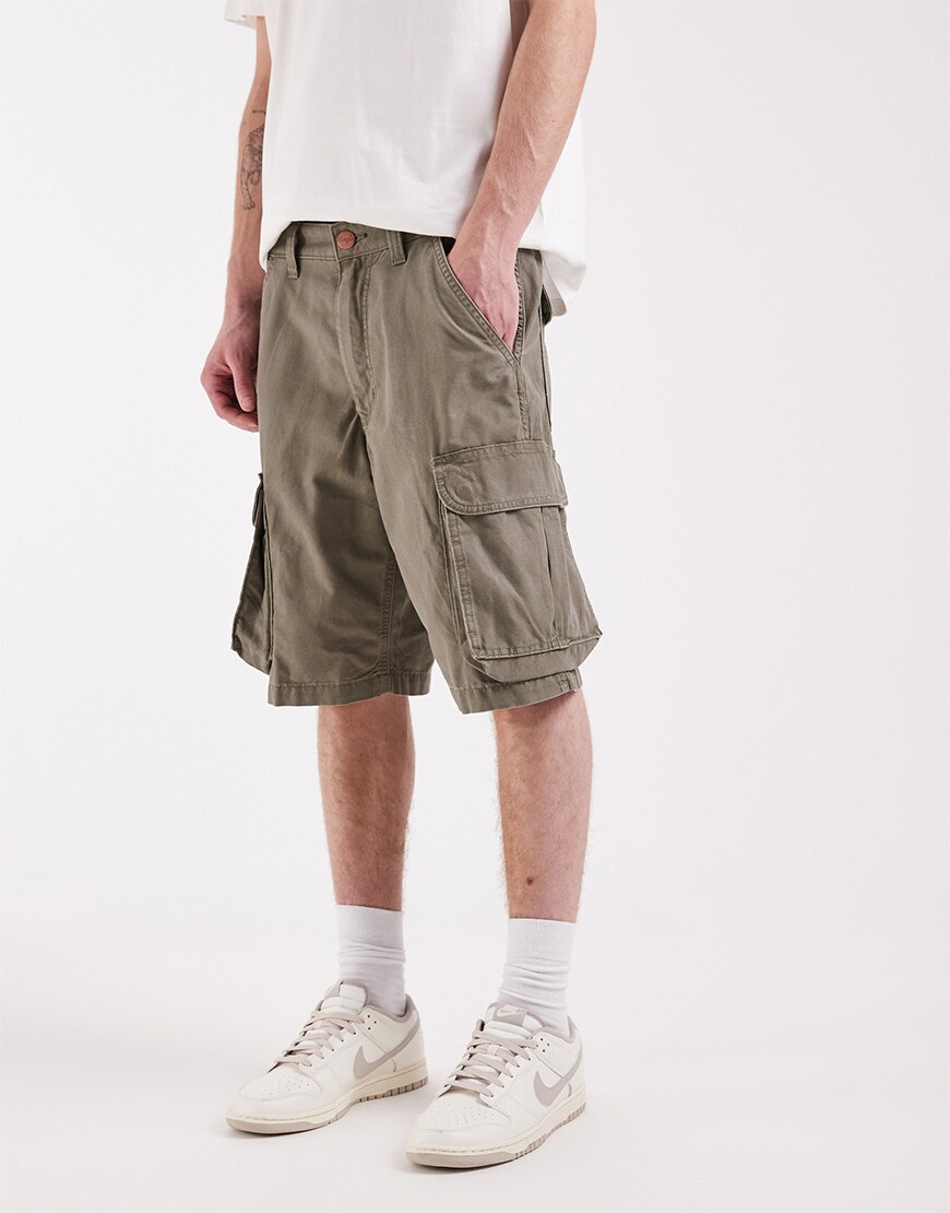 model wearing beige cargo shorts|ASOS Style Feed