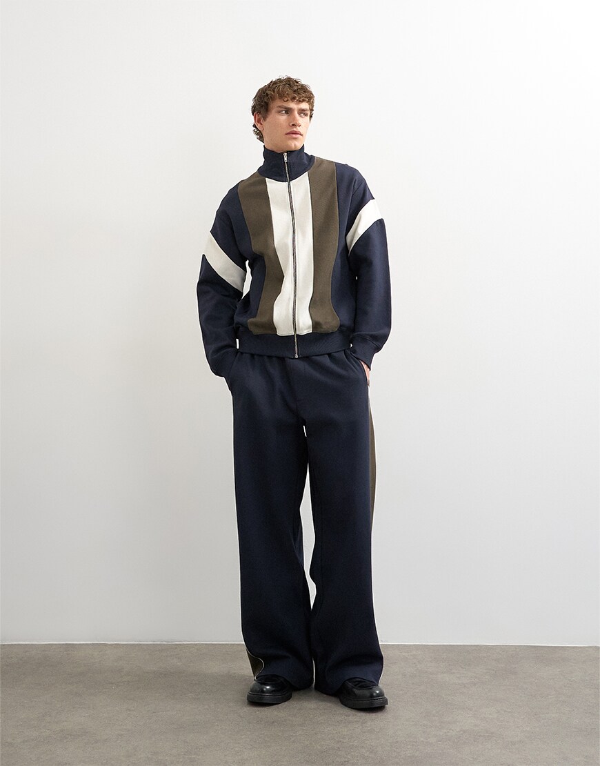 model wearing Topman navy tracksuit|ASOS Style Feed