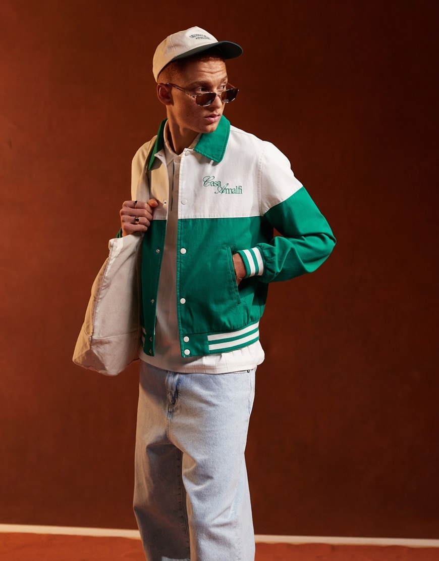 Person wearing ASOS DESIGN Oversized Harrington jacket with embroidered stitch detail in white and green