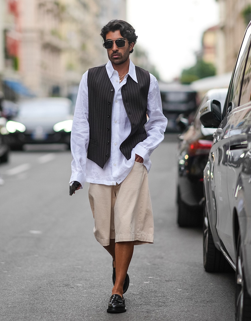 Guest wearing a waistcoat and baggy shorts | ASOS Style Feed