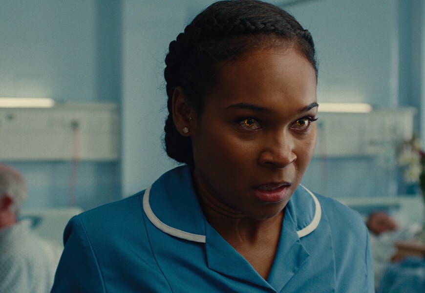 Supacell's Sabrina in nurses uniform with yellow eyes. | ASOS Style Feed