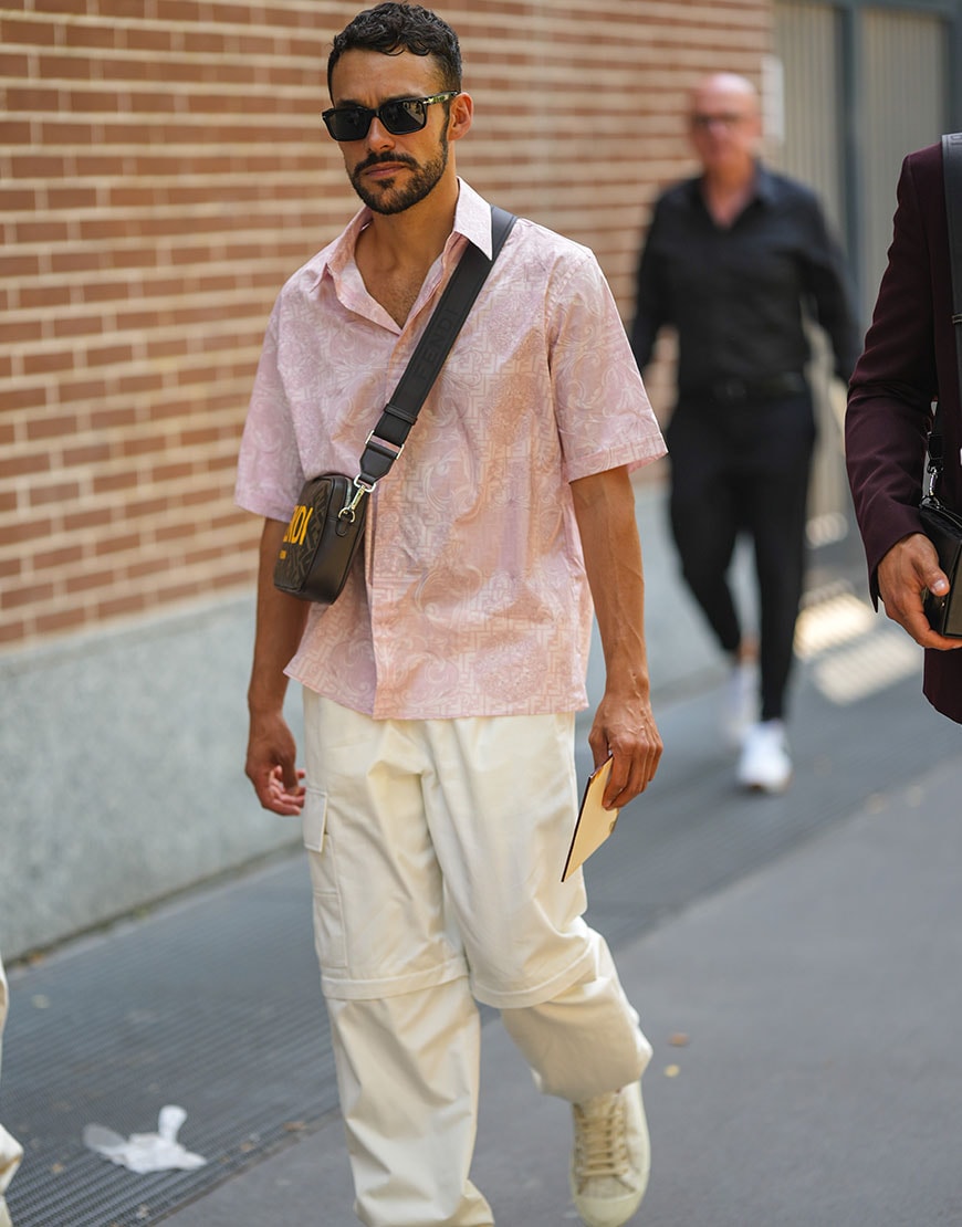 Street styler wearing pale pink to enhance his tan | ASOS Style Feed