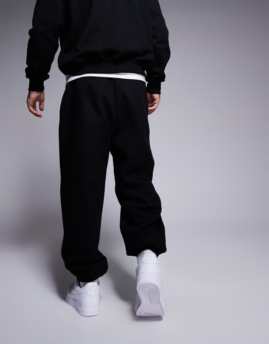 Man wearing black thick joggers
