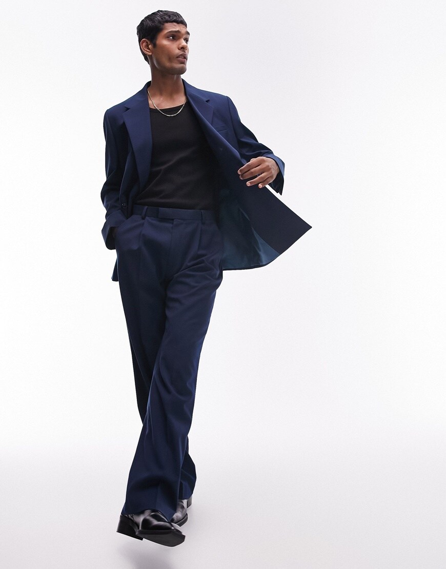 Model wearing navy oversized suit with black t shirt