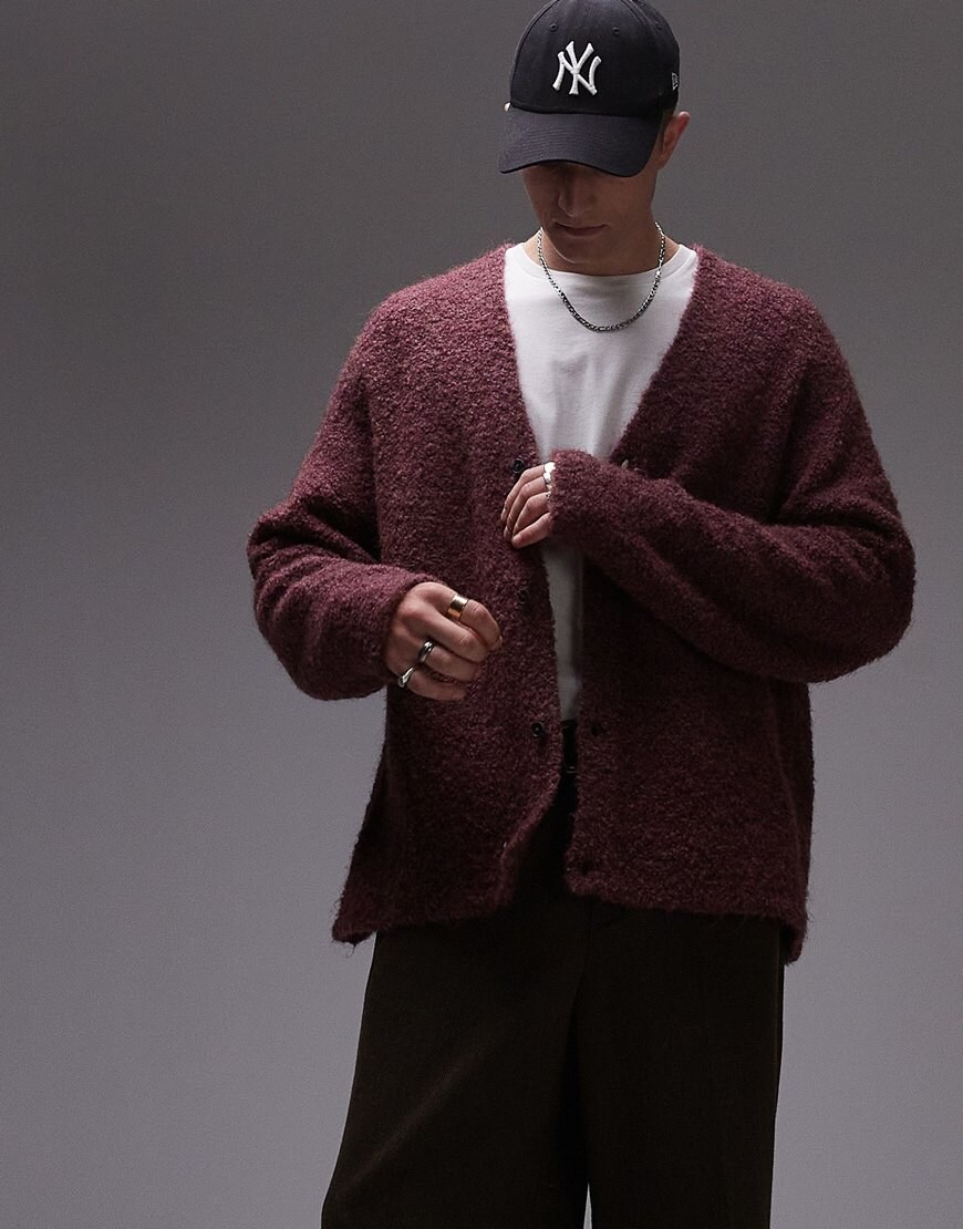 Model wearing white t shirt with burgundy knitted cardigan