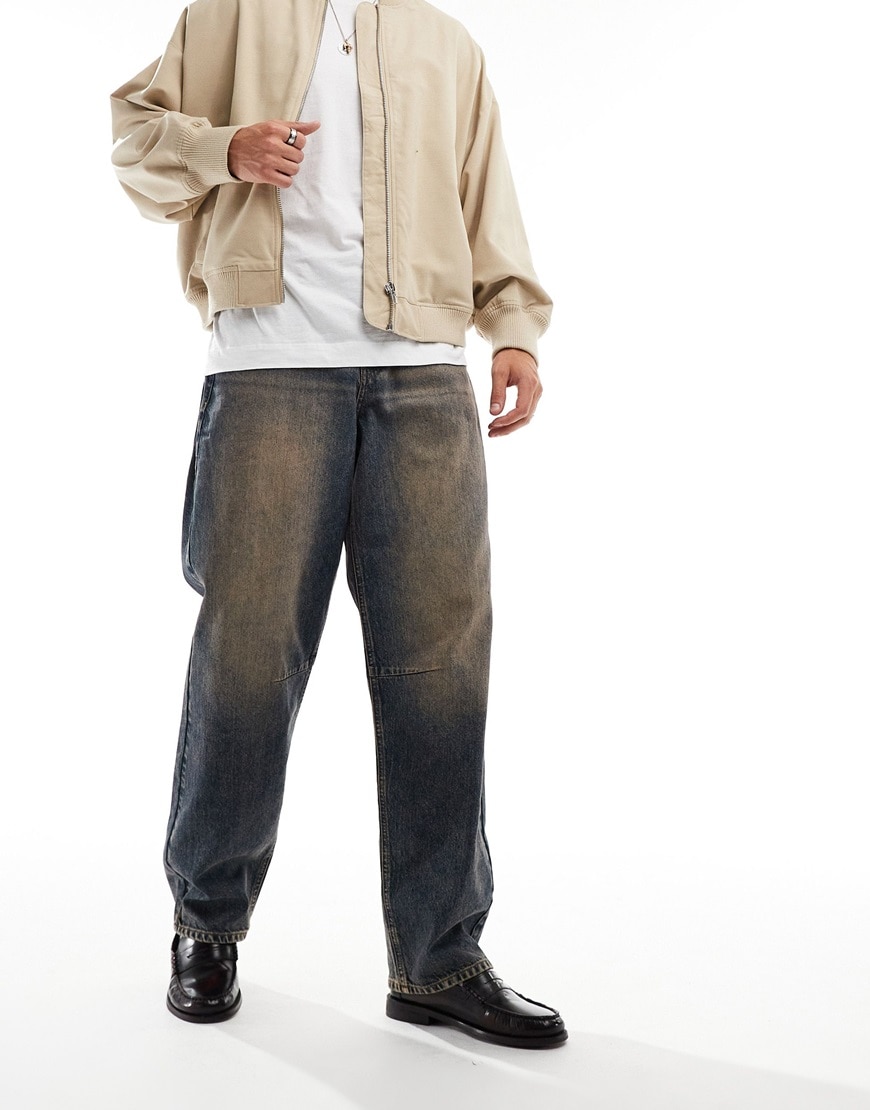 Model wearing brownish-blue baggy jeans