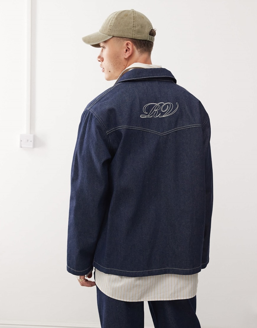 Model wearing dark blue denim jacket