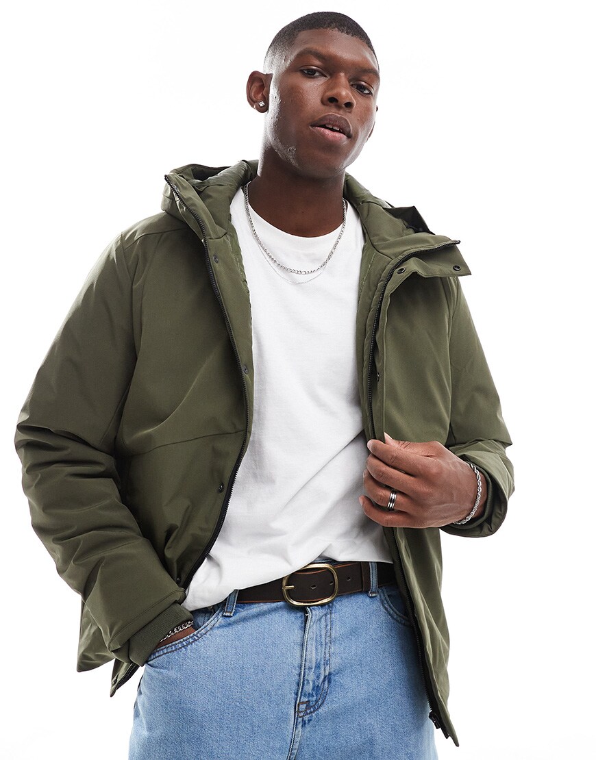 A model wearing a khaki parka jacket