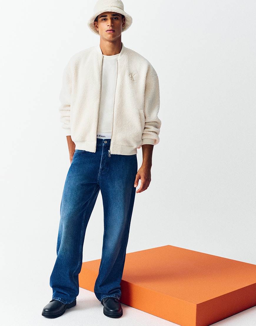 Model wearing CK Jeans borg hat, jacket, and denim jeans | ASOS Style Feed