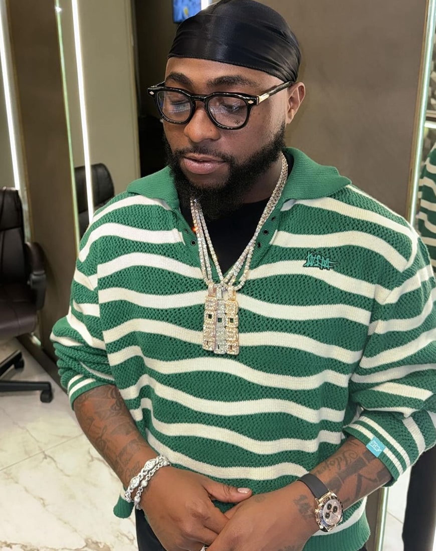 Nigerian artist Davido wearing Wall Street Mafia striped rugby top