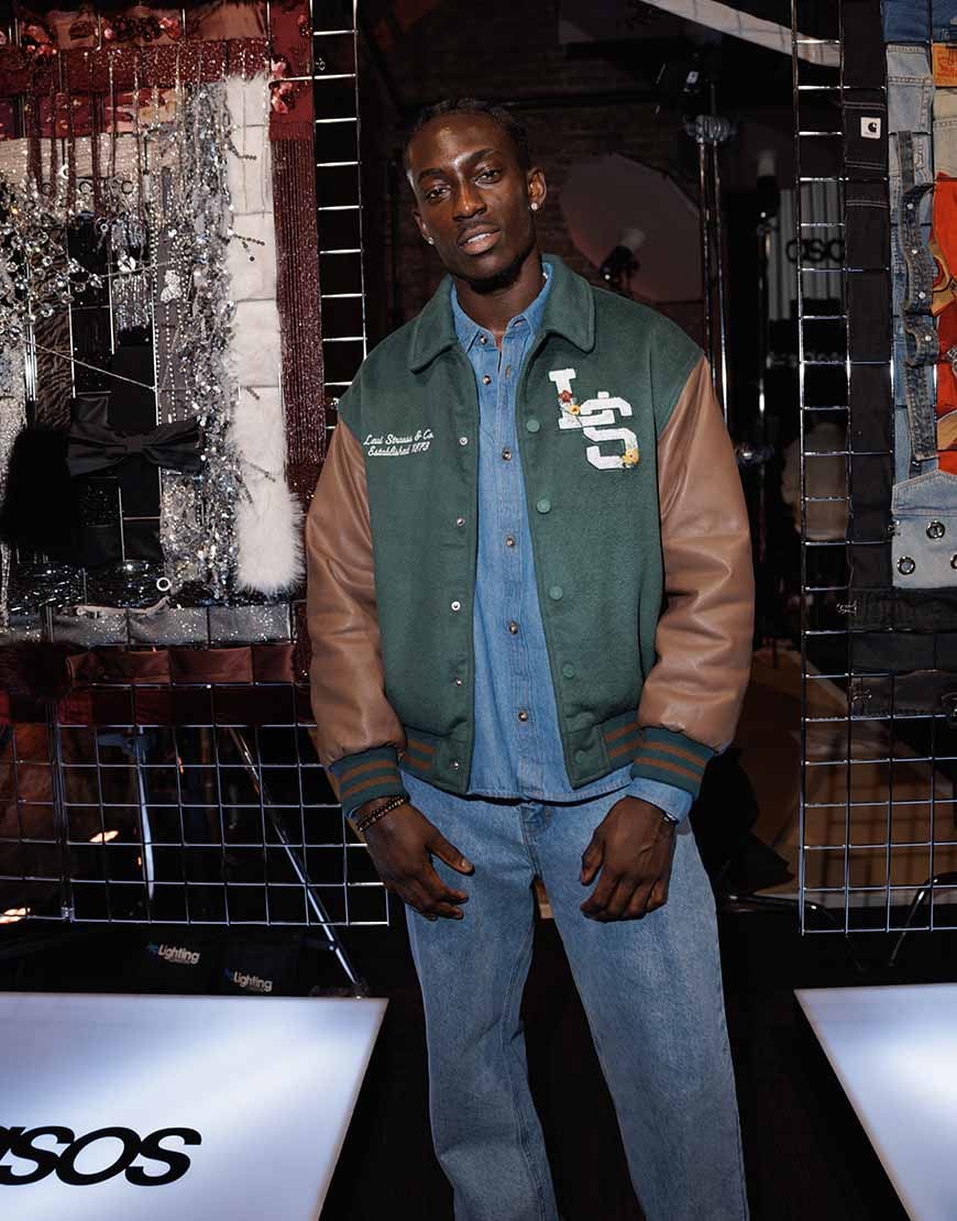Kanaan wearing varsity jacket and denim co-ord | ASOS Style Feed