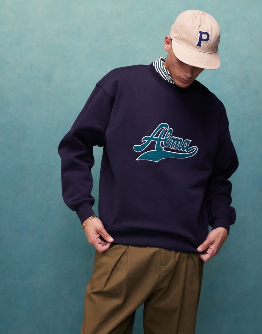 A man in a blue Alma de Ace sweatshirt | ASOS Style Feed