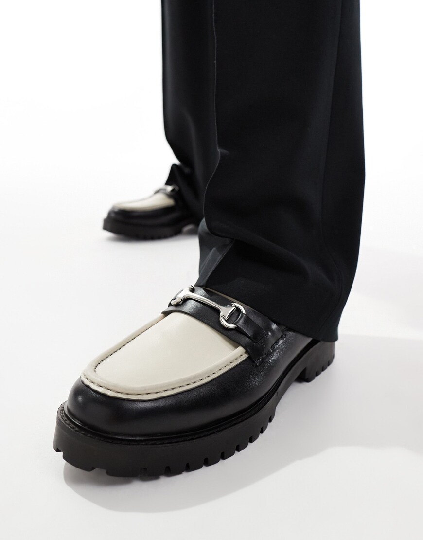 Black loafers with white contrast front panel