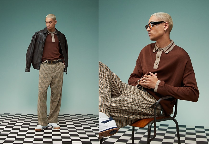 Model wearing an eclectic grandpa outfit on a green background