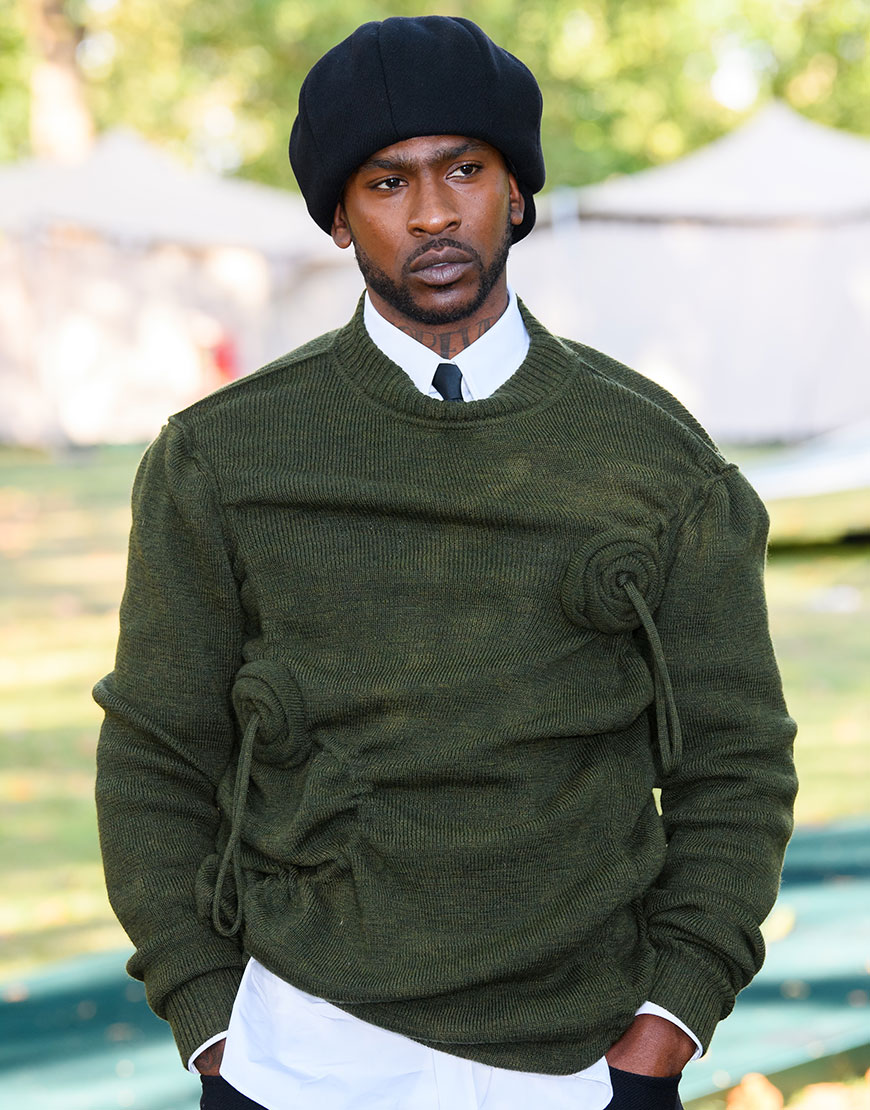 Skepta wearing a khaki green knitted jumper | ASOS Style Feed