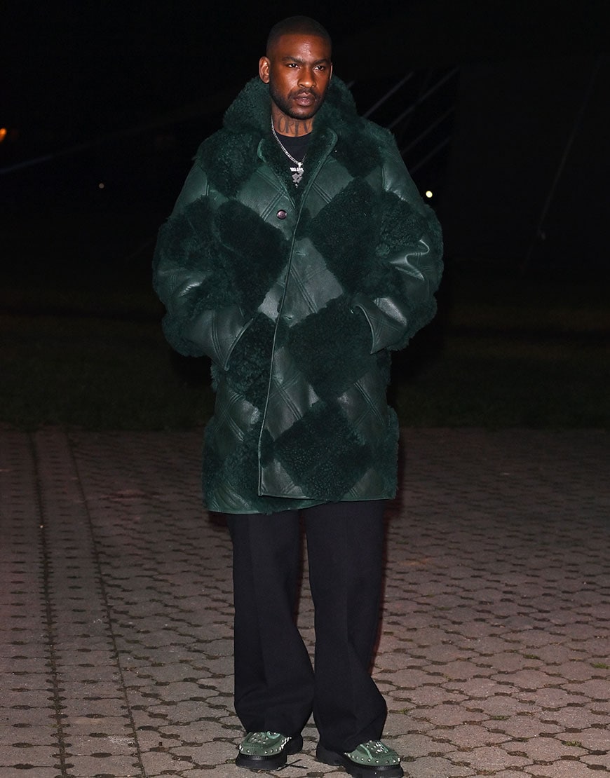 Skepta wearing a green coat at the Burberry Show | ASOS Style Feed