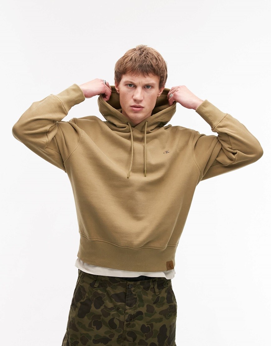 Model in beige CK hoodie. | ASOS Style Feed