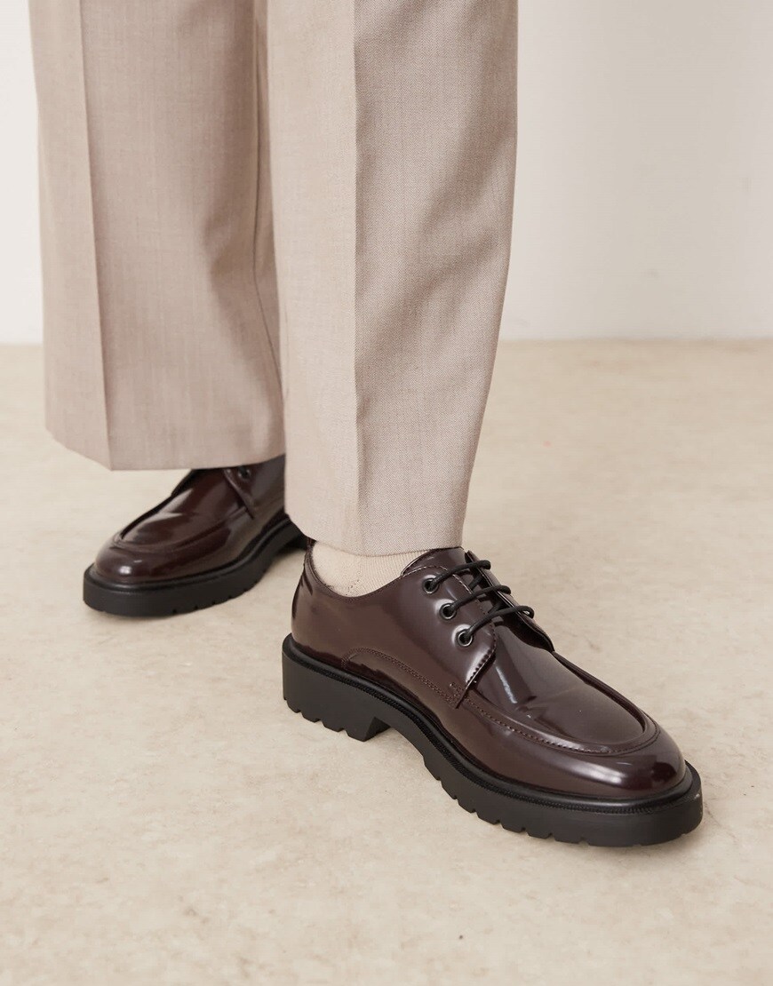 Model wearing brown lace-up brogue shoes