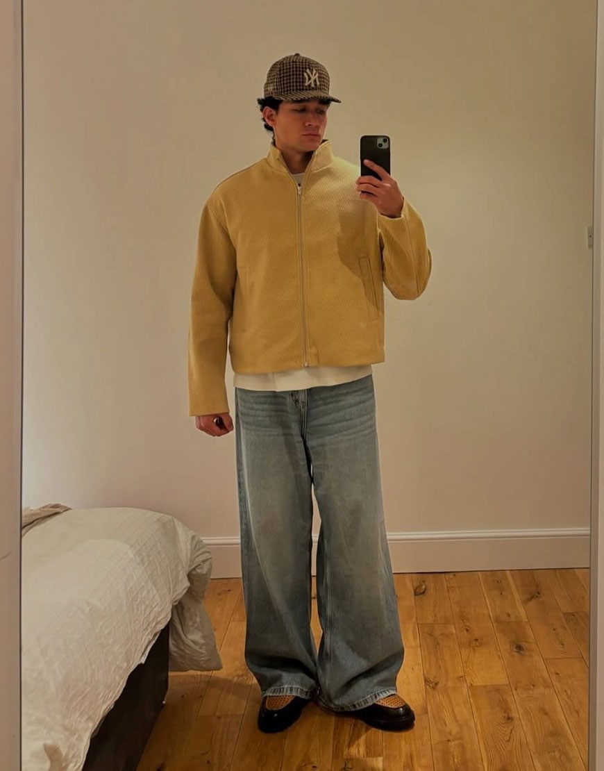 Man wearing yellow Harrington jacket