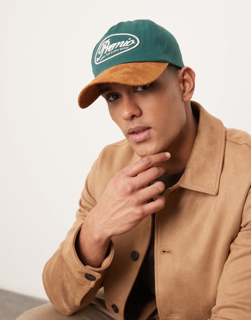 Model wearing green cap