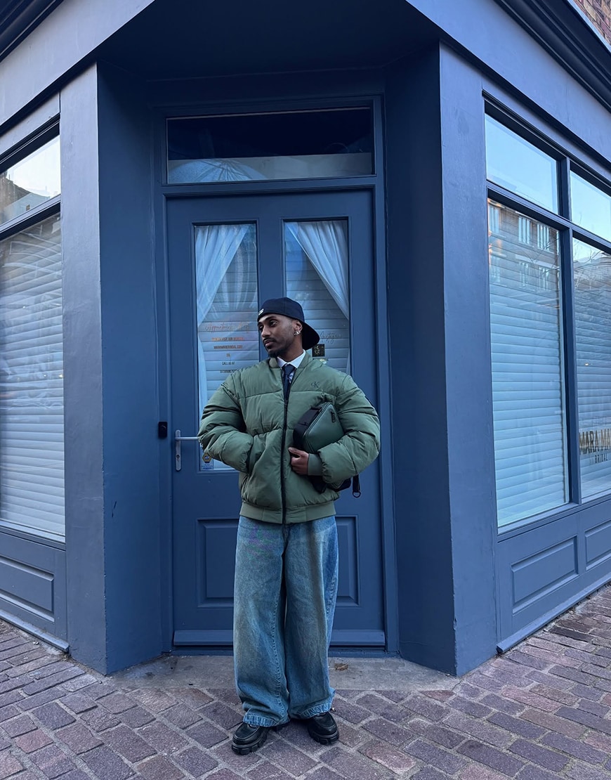 @frenchkidd__ wearing a navy tie with a green puffer jacket | ASOS Style Feed