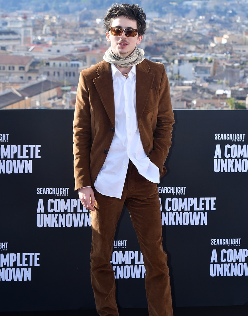 Timothée Chalamet wearing a brown suit