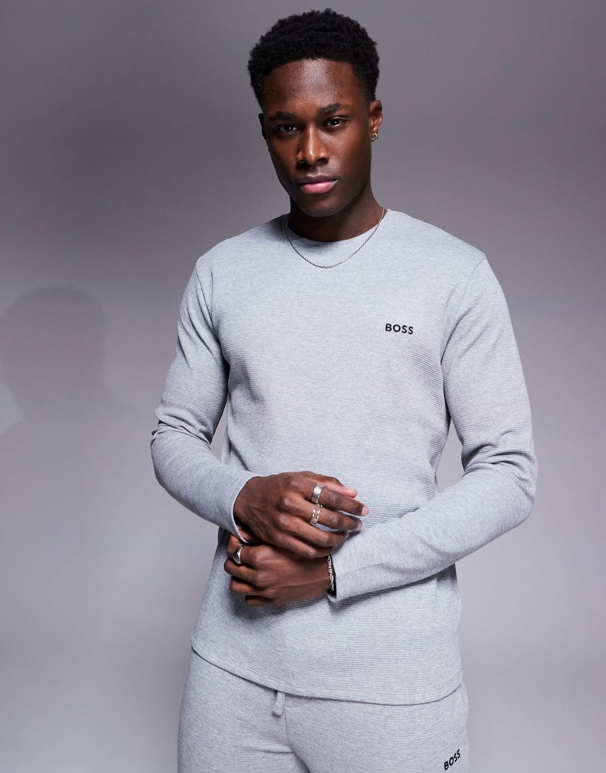 Model wearing a grey BOSS jumper