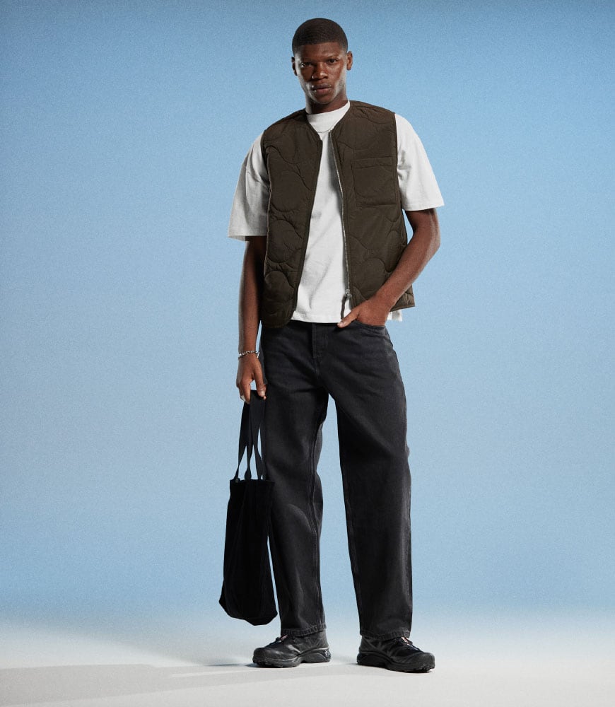 Man wearing black baggy jeans