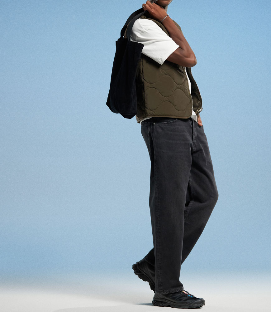 Man wearing black baggy jeans