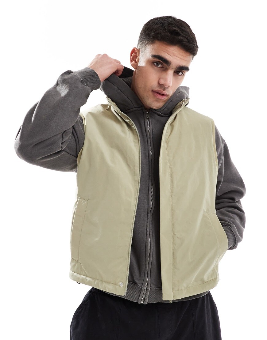 Man wearing a green puffer gilet