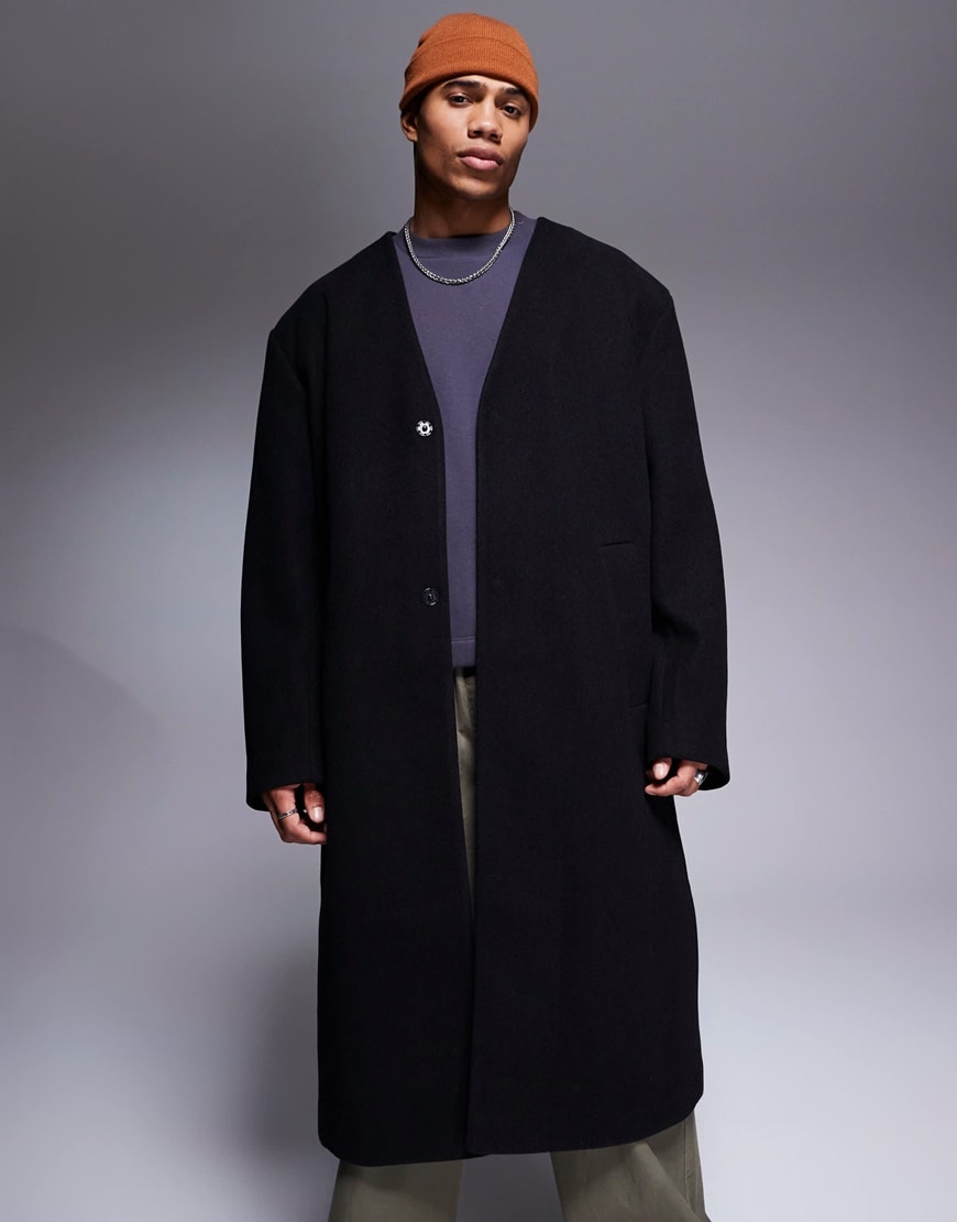 Model wearing a black overcoat
