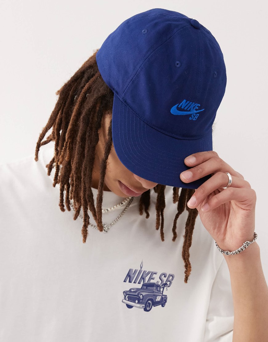 Man Wearing Blue Cap