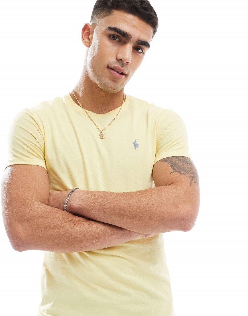 A model in a polo ralph lauren yellow t-shirt
