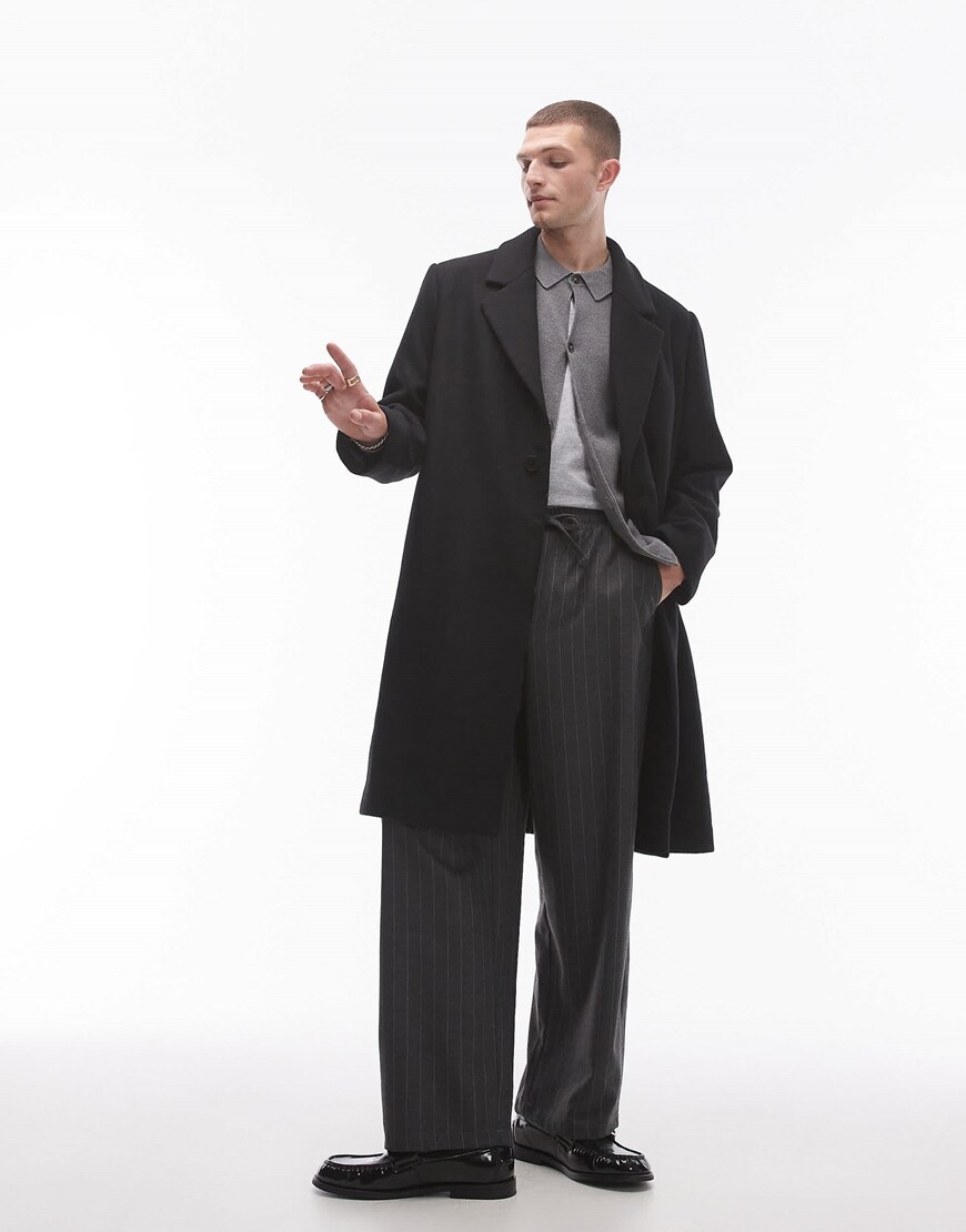 Model wearing a grey overcoat