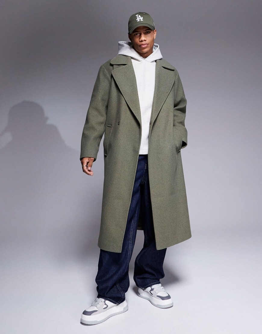 Model wearing a khaki overcoat