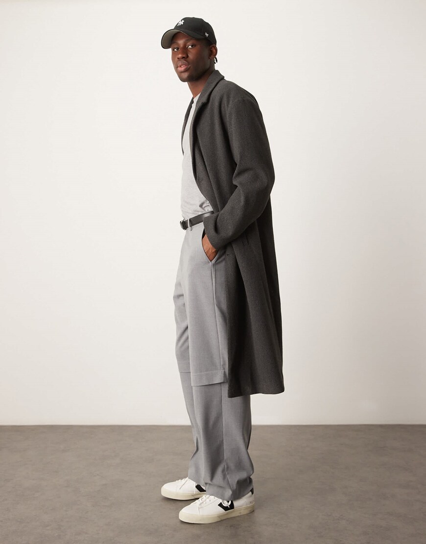 Model wearing a dark grey overcoat