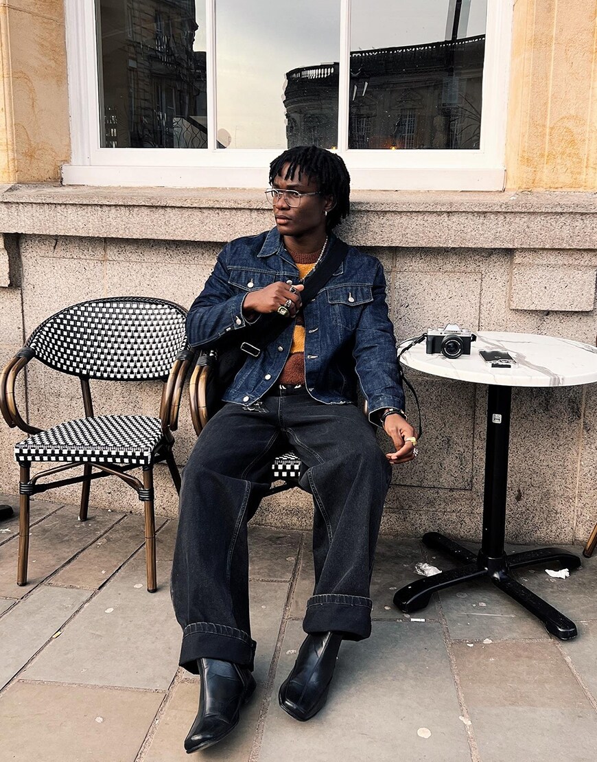 Man Wearing A Denim Jacket And Jeans