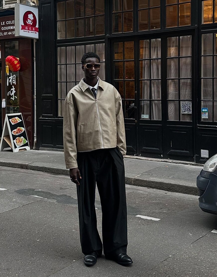 Man Wearing A Leather Jacket And Trousers