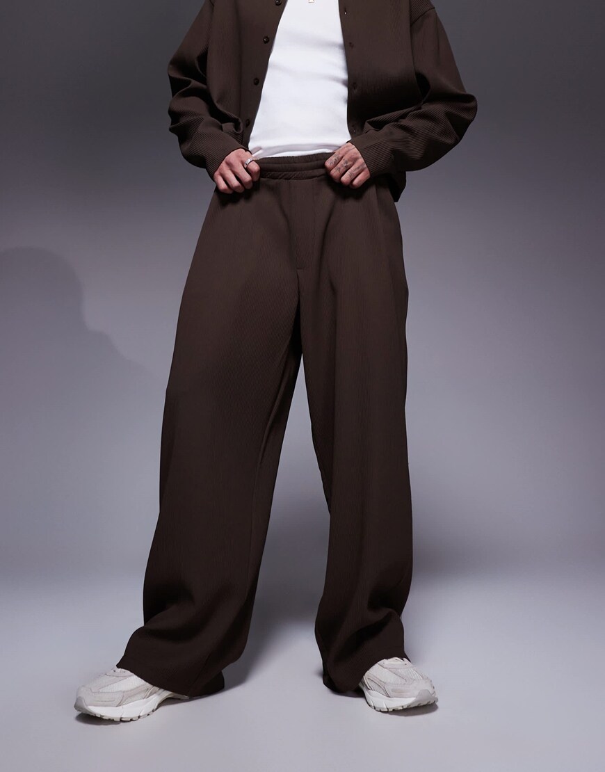 ASOS DESIGN super baggy plisse pants with elastic waist in brown