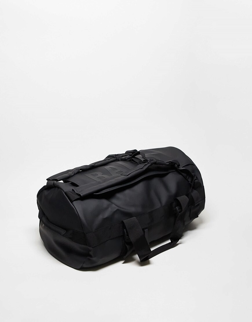 Rains Texel waterproof 56L duffle rucksack in black | ASOS Style Feed