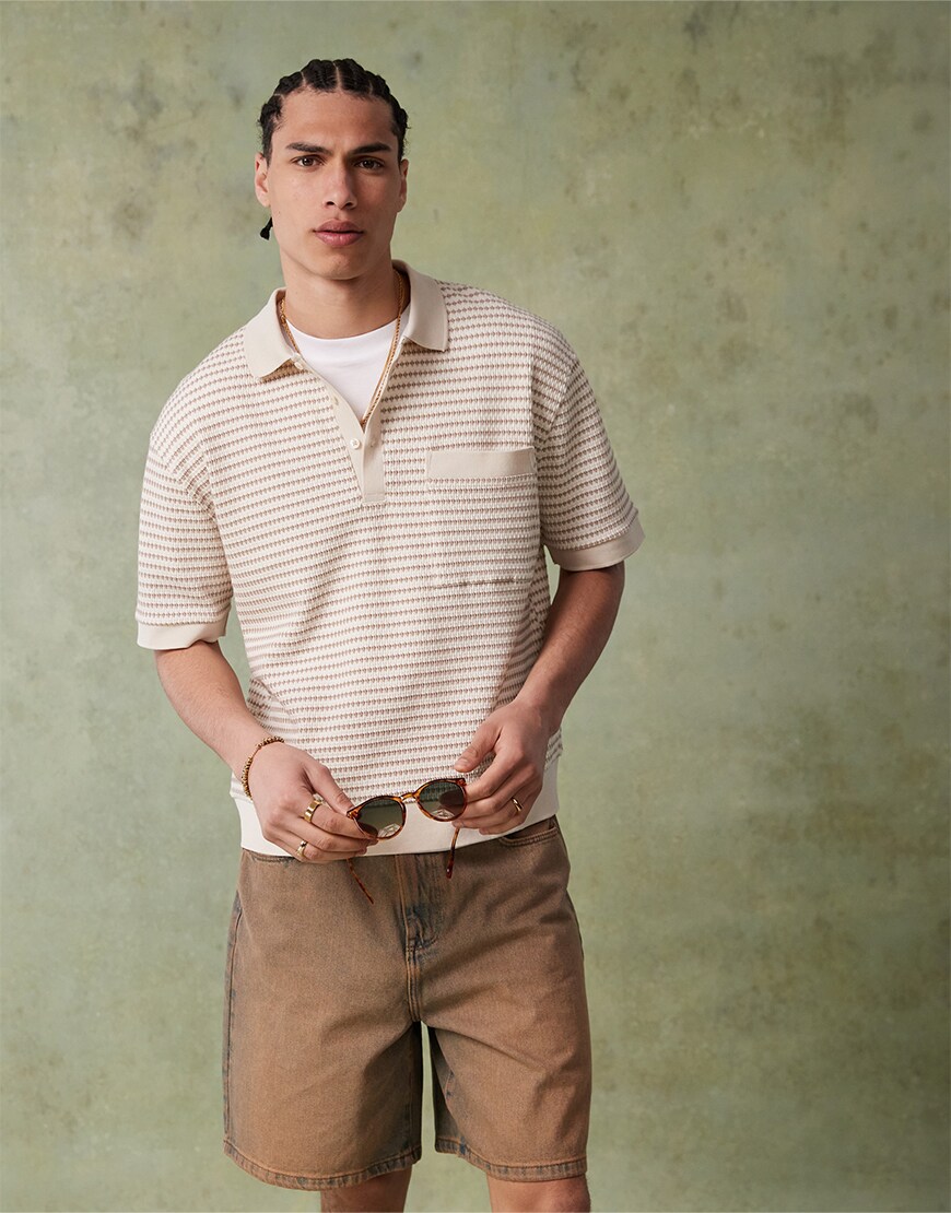 Man wearing a striped shirt and shorts